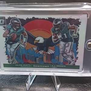 2024 Panini Optic Dual Downtown Jalen Hurts & A.J. Brown Novelty Card.